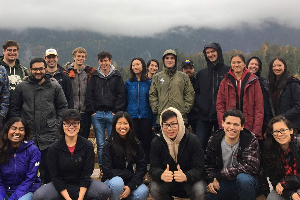 Georox members group photo with the mountains and clouds in the background