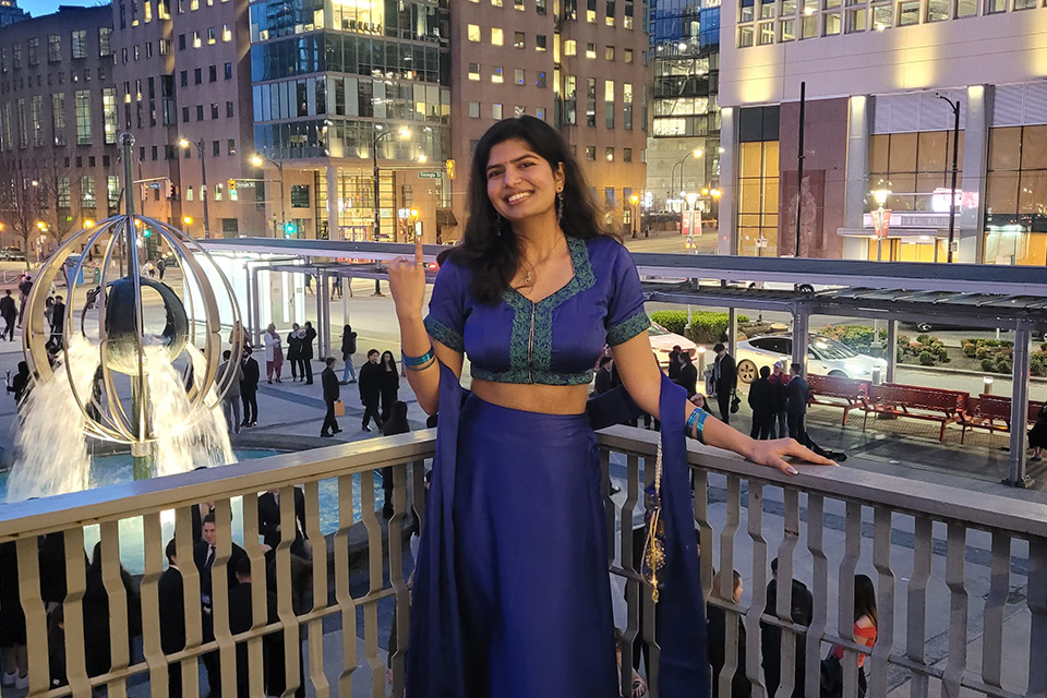 UBC Student in formal attire poses with Iron Ring