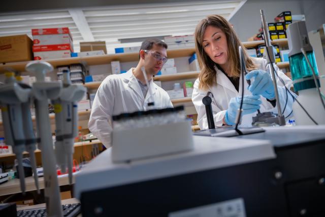 Two people work in a lab.