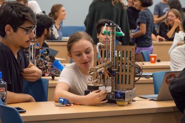 Students building a machine