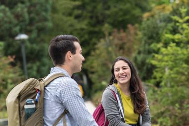 Students talking by a fountain
