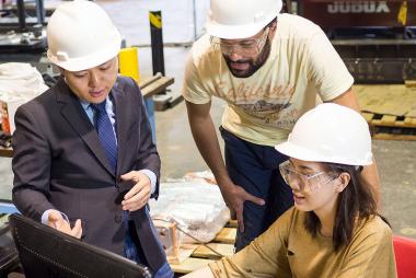 Engineers working on a computer