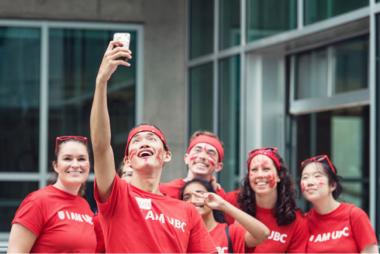A group of students and staff taking a selfie outside the Engineering Design Centre.