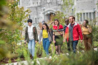 Group of students walking in front of Irving K. Barber Learning Centre on the UBC Vancouver campus