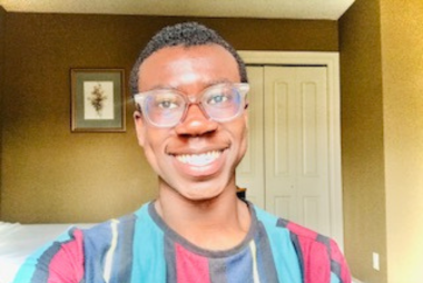 Martin smiling in front of the camera