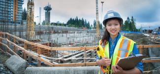 Student wearing hard hat in construction site