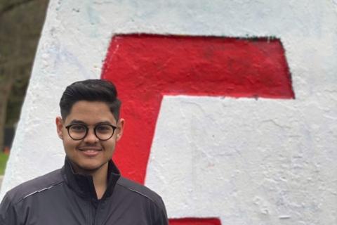 Bishoy Helmy, with UBC Steel Bridge Design Team gear in front of the UBC Engineering Cairn