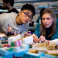 Two UBC mechanical engineering students prepare for the autonomous landing platform competition.